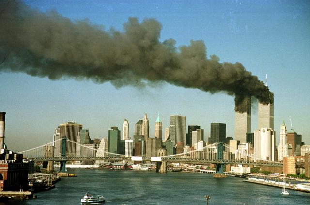 The towers of the World Trade Center billow smoke shortly after being struck by hijacked commercial airplanes in New York in this file photo taken on September 11, 2001. (Brad Rickerby/REUTERS)