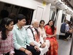 PM Modi interacting with young commuters while travelling via Delhi Metro on Friday. PM Modi interacting with young commuters while travelling via Delhi Metro on Friday.