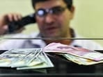 Currency seen at a forex bureau counter in New Delhi. Currency seen at a forex bureau counter in New Delhi.