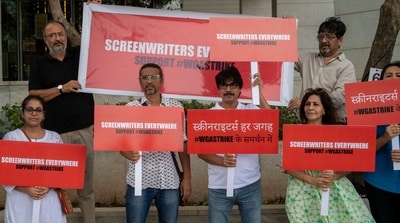 Screenwriter and active Screen Writers Association member Anjum Rajabali (top row, extreme left) led a demonstration outside Netflix India's office in Mumbai on June 14 in solidarity with the Writers Guild of America members who are on strike. (Satish Bate/HT Photo)