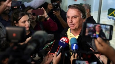 Brazil's former president Jair Bolsonaro speaks with media. (Reuters)