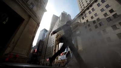 A man walks near the New York Stock Exchange. (Reuters)