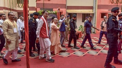 Uttar Pradesh chief minister Yogi Adityanath with deputy chief minister Keshav Prasad Maurya arrives to attend a 'Grih Pravesh' for 76 flats constructed under Pradhan Mantri Aawas Yojna at Lukarganj area, in Prayagraj on Friday. (PTI) Uttar Pradesh chief minister Yogi Adityanath with deputy chief minister Keshav Prasad Maurya arrives to attend a 'Grih Pravesh' for 76 flats constructed under Pradhan Mantri Aawas Yojna at Lukarganj area, in Prayagraj on Friday. (PTI)
