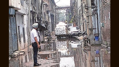 The road at Narinder Nagar near Samrala Chowk was inundated with industrial waste. (HT PHOTO) The road at Narinder Nagar near Samrala Chowk was inundated with industrial waste. (HT PHOTO)