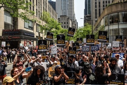 Writers Guild of America (WGA) members and supporters on a picket line outside NBC Universal headquarters in New York on May 23. (Reuters)