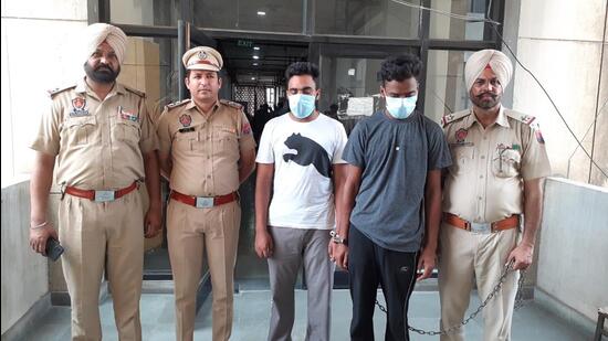 The accused Daljit Singh of Churchak village and Pritpal Singh of Gholia Khurd village in Moga, both allegedly backed by Gurpatwant Singh Pannu, the US-based founder of banned separatist organization, Sikh for Justice (SFJ), who were arrested for scribbling pro-Khalistan slogans at Moga bus stand. (HT Photo)
