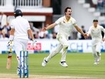 Pat Cummins celebrates after taking the wicket of England's Joe Root, caught by David Warner