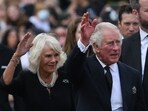 Britain's King Charles III (R) and Camilla wave as they greet the crowd. Britain's King Charles III (R) and Camilla wave as they greet the crowd.