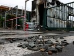 A burnt bungalow at the entrance of a parking following a fourth consecutive night of rioting in France sparked by the death of teenage driver Nahel by a police bullet, in the Aubiers district of Bordeaux, south-western France. (AFP)
