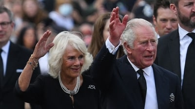 Britain's King Charles III (R) and Camilla wave as they greet the crowd. (AFP) Britain's King Charles III (R) and Camilla wave as they greet the crowd. (AFP)
