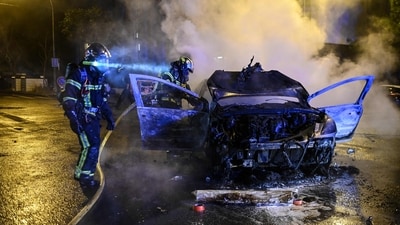 The French teen, identified only as Nahel, was shot during a traffic stop on Tuesday in the Paris suburb of Nanterre. The video showed two officers at the window of the car, one with his gun pointed at the driver. As the teenager pulled forward, the officer fired once through the windshield. (AFP) The French teen, identified only as Nahel, was shot during a traffic stop on Tuesday in the Paris suburb of Nanterre. The video showed two officers at the window of the car, one with his gun pointed at the driver. As the teenager pulled forward, the officer fired once through the windshield. (AFP)