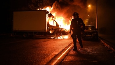Looters have ransacked dozens of shops and torched some 2,000 vehicles since the riots started. (AFP) Looters have ransacked dozens of shops and torched some 2,000 vehicles since the riots started. (AFP)