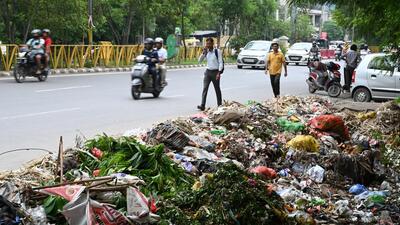 Gurugram, India-July 01, 2023: Piles of Garbage spread on the roads due to the dispute in between Municipal Corporation of Gurugram (MCG) and its waste collection concessionaire Ecogreen Energy at Sohna road near PWD rest house, in Gurugram, India, 01 July 2023. (Photo by Parveen Kumar/Hindustan Times)**To go with Leena's Story Gurugram, India-July 01, 2023: Piles of Garbage spread on the roads due to the dispute in between Municipal Corporation of Gurugram (MCG) and its waste collection concessionaire Ecogreen Energy at Sohna road near PWD rest house, in Gurugram, India, 01 July 2023. (Photo by Parveen Kumar/Hindustan Times)**To go with Leena's Story