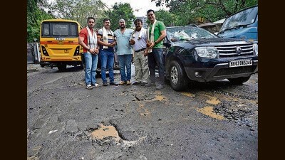 Sukhjit Singh Atwal, a resident from the area, said, “Besides the road filled with craters, encroachments like garages make the road narrower making it difficult for pedestrians to walk on the footpath, forcing them to walk on the road. The road is choc-a-block during peak hours.” (Vijay Bate/HT Photo)