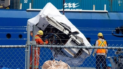 Debris from the Titan submersible, recovered from the ocean floor near the wreck of the Titanic, is unloaded from the ship Horizon Arctic at the Canadian Coast Guard pier in St. John's, Newfoundland (AP) Debris from the Titan submersible, recovered from the ocean floor near the wreck of the Titanic, is unloaded from the ship Horizon Arctic at the Canadian Coast Guard pier in St. John's, Newfoundland (AP)