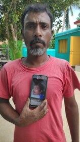 Shibkant Roy showing the photo of his son Bipul Roy. Shibkant Roy showing the photo of his son Bipul Roy.