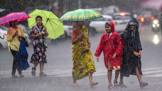 People going through the heavy rain at Parel in Mumbai, on Friday, June 30. (Photo by Satish Bate/ Hindustan Times) People going through the heavy rain at Parel in Mumbai, on Friday, June 30. (Photo by Satish Bate/ Hindustan Times)