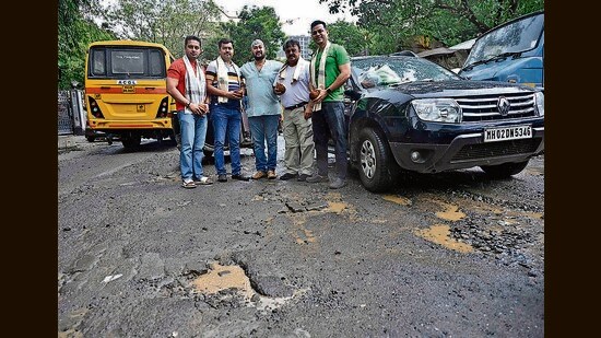 Sukhjit Singh Atwal, a resident from the area, said, “Besides the road filled with craters, encroachments like garages make the road narrower making it difficult for pedestrians to walk on the footpath, forcing them to walk on the road. The road is choc-a-block during peak hours.” (Vijay Bate/HT Photo)