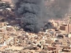 An aerial view of the black smoke and flames at a market in Omdurman, Khartoum North, Sudan.
