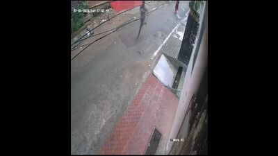 A video grab from the viral video where a woman is seen running behind the accused in Lucknow (Sourced) A video grab from the viral video where a woman is seen running behind the accused in Lucknow (Sourced)