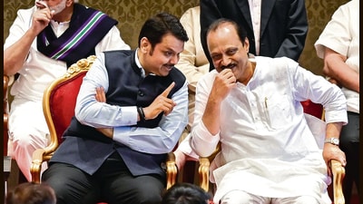 BJP leader Devendra Fadnavis and NCP leader Ajit Pawar at Raj Bhavan in Mumbai on Sunday. (Anshuman Poyrekar/HT Photo) BJP leader Devendra Fadnavis and NCP leader Ajit Pawar at Raj Bhavan in Mumbai on Sunday. (Anshuman Poyrekar/HT Photo)