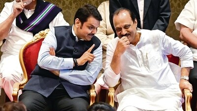 BJP leader Devendra Fadnavis and NCP leader Ajit Pawar at Raj Bhavan in Mumbai on Sunday. (Anshuman Poyrekar/HT Photo) BJP leader Devendra Fadnavis and NCP leader Ajit Pawar at Raj Bhavan in Mumbai on Sunday. (Anshuman Poyrekar/HT Photo)