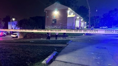 In this photo released by the Baltimore Police Department, police tape cordons off the area of a mass shooting incident in the Southern District of Baltimore, Maryland, early Sunday, July 2, 2023. (AP) In this photo released by the Baltimore Police Department, police tape cordons off the area of a mass shooting incident in the Southern District of Baltimore, Maryland, early Sunday, July 2, 2023. (AP)