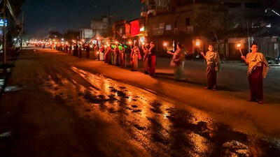 Women form a human chain to protest against the ethnic violence between Meitei and Kuki community (PTI) Women form a human chain to protest against the ethnic violence between Meitei and Kuki community (PTI)