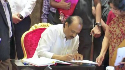 Nationalist Congress Party (NCP) leader Ajit Pawar signs documents after taking oath as Maharashtra Deputy Chief Minister, at Raj Bhavan, in Mumbai. (PTI) Nationalist Congress Party (NCP) leader Ajit Pawar signs documents after taking oath as Maharashtra Deputy Chief Minister, at Raj Bhavan, in Mumbai. (PTI)