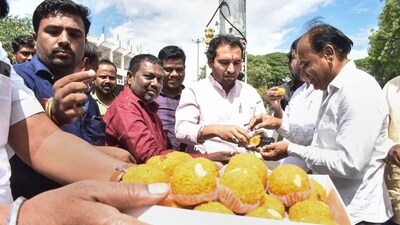 NCP workers celebrate in Solapur after party leader Ajit Pawar joined the Maharashtra government as the deputy chief minister on Sunday. (PTI) NCP workers celebrate in Solapur after party leader Ajit Pawar joined the Maharashtra government as the deputy chief minister on Sunday. (PTI)
