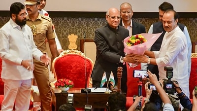 Maharashtra Governor Ramesh Bais congratulates the newly sworn-in Deputy Chief Minister Ajit Pawar, during a ceremony at Raj Bhavan, in Mumbai, Sunday, July 2, 2023. Maharashtra Chief Minister Eknath Shinde and Deputy Chief Minister Devendra Fadnavis are also seen. (PTI) Maharashtra Governor Ramesh Bais congratulates the newly sworn-in Deputy Chief Minister Ajit Pawar, during a ceremony at Raj Bhavan, in Mumbai, Sunday, July 2, 2023. Maharashtra Chief Minister Eknath Shinde and Deputy Chief Minister Devendra Fadnavis are also seen. (PTI)
