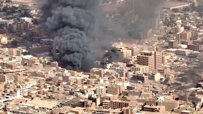 An aerial view of the black smoke and flames at a market in Omdurman, Khartoum North, Sudan. (via REUTERS)