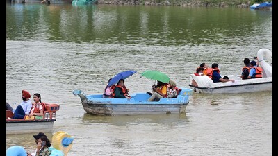 Tourists enjoying boating at Sukhna lake in Chandigarh on Sunday. (Ravi Kumar/HT)