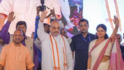 Union Home Minister Amit Shah with Apna Dal (Sonelal) leader and Union Minister Anupriya Patel at the 'Jan Swabhiman Divas' programme on the birth anniversary of Apna Dal founder Sonelal Patel, in Lucknow on Sunday. (PTI) Union Home Minister Amit Shah with Apna Dal (Sonelal) leader and Union Minister Anupriya Patel at the 'Jan Swabhiman Divas' programme on the birth anniversary of Apna Dal founder Sonelal Patel, in Lucknow on Sunday. (PTI)