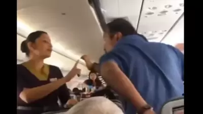 An air hostess is heard calling for the captain of the flight to escalate the matter. (Screengrab/twitter) An air hostess is heard calling for the captain of the flight to escalate the matter. (Screengrab/twitter)
