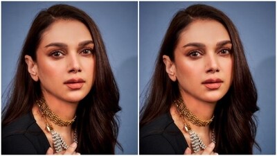 Aditi's gown featured a monochrome and maroon belt at the waist, adding to more ethnic vibes of her look. In a golden neck choker, white necklace and multiple golden rings, Aditi further accessorised her look for the day.&nbsp; (Instagram/@aditiraohydari)