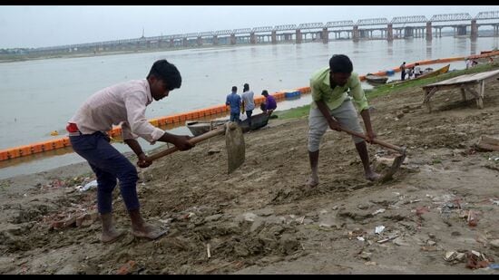 Ghats being cleaned ahead of the Kanwar Yatra in Prayagraj (HT Photo)