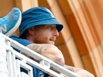 England's Ben Stokes watches Josh Tongue and James Anderson bat from the balcony 