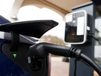 The charging plug of a Tesla electric car is pictured.