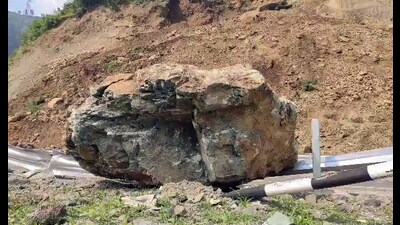 A huge rock blocks the Jammu-Srinagar National Highway after a landslide hit the area in Ramban district on Monday. (ANI)