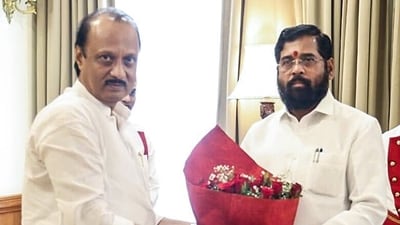 Maharashtra chief minister Eknath Shinde congratulates the newly sworn-in state deputy CM Ajit Pawar at Raj Bhavan in Mumbai on Sunday. (Eknath Shinde Twitter)