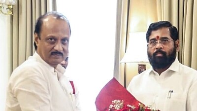 Maharashtra chief minister Eknath Shinde congratulates the newly sworn-in state deputy CM Ajit Pawar at Raj Bhavan in Mumbai on Sunday. (Eknath Shinde Twitter) Maharashtra chief minister Eknath Shinde congratulates the newly sworn-in state deputy CM Ajit Pawar at Raj Bhavan in Mumbai on Sunday. (Eknath Shinde Twitter)