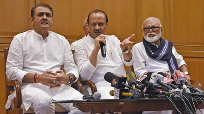 Newly sworn-in Maharashtra deputy chief minister Ajit Pawar addresses a press conference with newly sworn-in state minister Chhagan Bhujbal and NCP working president Praful Patel in Mumbai on Sunday. (ANI) Newly sworn-in Maharashtra deputy chief minister Ajit Pawar addresses a press conference with newly sworn-in state minister Chhagan Bhujbal and NCP working president Praful Patel in Mumbai on Sunday. (ANI)