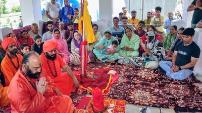 Mahant Deependra Giri, the custodian of the 'Chhari Mubarak' or the holy Mace of Lord Shiva performs rituals at the commencement of annual pilgrimage of Chhari-Mubarak Swami Amarnath on the occasion of Guru Purnima at Pahalgam in Anantnag. (ANI)