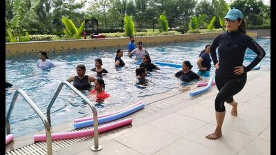 Aqua yoga instructor Rajni Mandhya guiding students during a session. Aqua yoga instructor Rajni Mandhya guiding students during a session.