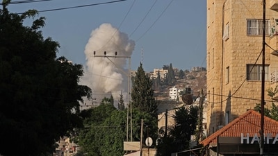 Smoke billows following an Israeli airstrike in the occupied West Bank city of Jenin on July 3, 2023. The Israeli army said it had launched air strikes in the occupied West Bank city of Jenin in an "extensive counterterrorism effort" that the Palestinian health ministry said had killed three residents and injured at least 25 more. (Photo by Jaafar ASHTIYEH / AFP) Smoke billows following an Israeli airstrike in the occupied West Bank city of Jenin on July 3, 2023. The Israeli army said it had launched air strikes in the occupied West Bank city of Jenin in an "extensive counterterrorism effort" that the Palestinian health ministry said had killed three residents and injured at least 25 more. (Photo by Jaafar ASHTIYEH / AFP)