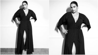 Her dress features a shimmer fabric with cape-cut sleeves and a high-low hem. It has a subtle tie-up detail, a mid-thigh slit, and a plunging neckline. (Instagram/@who_wore_what_when) Her dress features a shimmer fabric with cape-cut sleeves and a high-low hem. It has a subtle tie-up detail, a mid-thigh slit, and a plunging neckline. (Instagram/@who_wore_what_when)