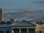 FILE - With the Washington Monument in the background, the American flag flies at half-staff over the White House, Sept. 8, 2022, in Washington, after Queen Elizabeth II, Britain's longest-reigning monarch and a rock of stability across much of a turbulent century, died at 96 after 70 years on the throne. Only in the mid-19th century does the U.S. flag become a permanent fixture at the White House, scholars believe. (AP Photo/Gemunu Amarasinghe, File) FILE - With the Washington Monument in the background, the American flag flies at half-staff over the White House, Sept. 8, 2022, in Washington, after Queen Elizabeth II, Britain's longest-reigning monarch and a rock of stability across much of a turbulent century, died at 96 after 70 years on the throne. Only in the mid-19th century does the U.S. flag become a permanent fixture at the White House, scholars believe. (AP Photo/Gemunu Amarasinghe, File)