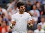 Spain’s Carlos Alcaraz celebrates winning his first round match against France’s Jeremy Chardy