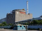 A Russian service member stands guard at a checkpoint near the Zaporizhzhia Nuclear Power Plant outside Enerhodar in the Zaporizhzhia region, Russian-controlled Ukraine.